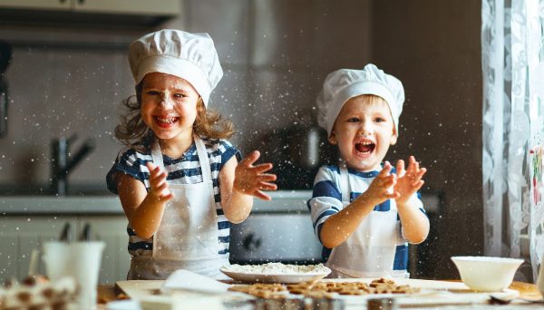 small children cooking together