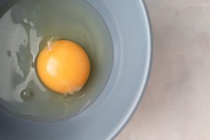 Raw egg in pan