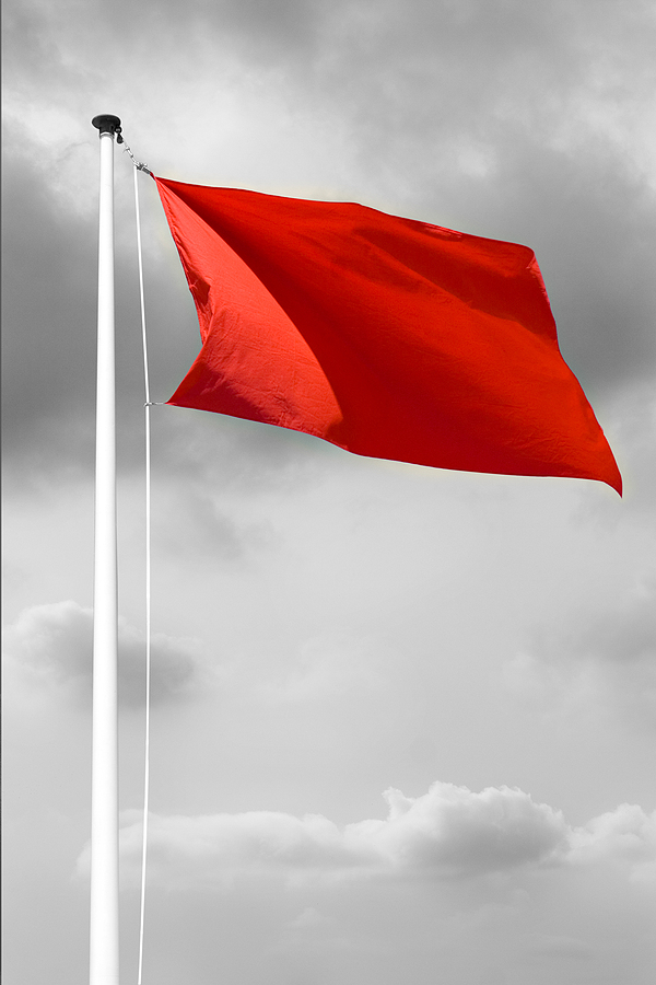 Red danger flag at the beach before a storm or hurricane