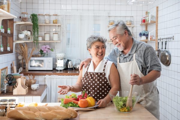 senior couple cooking in the kitchen