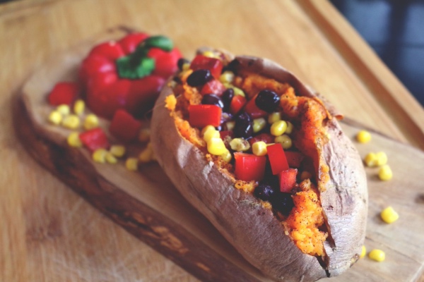 savory southwest sweet potato on a wooden plate