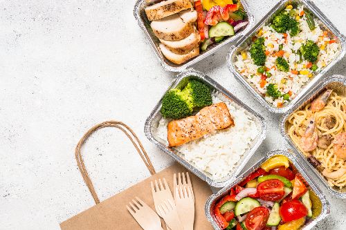 food delivery container spread out on kitchen counter