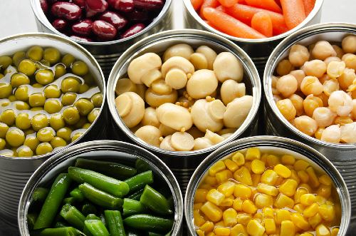 opened cans of a variety of canned vegetables 