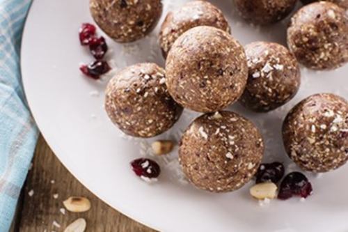 cinnamon raisin almond balls on a white plate