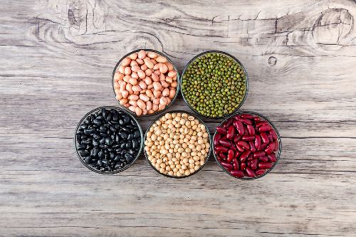 variety of dried beans in bowls 