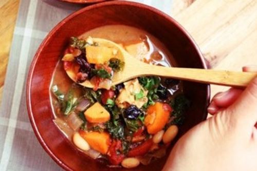 West-African Peanut Stew served in a read bowl 
