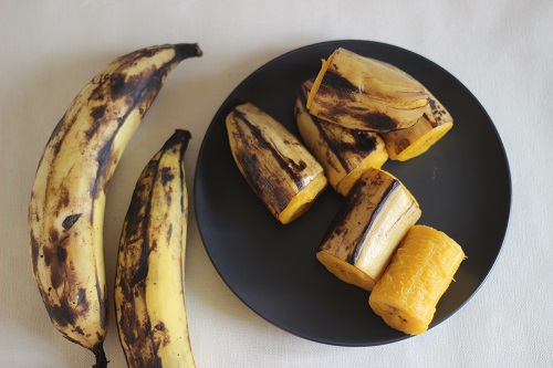 Ripe plantain Steamed and served on dark grey medium size plate. 