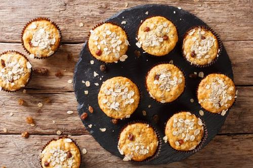 oatmeal raisin muffins on a black platter