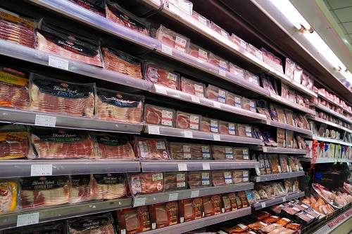 Meat Aisle In Supermarket with packaged meats