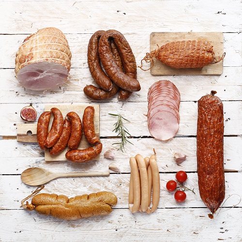 flat lay of different types of cured, smoked, and dried meats