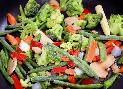 an assortment of colourful frozen veggies - ready for cooking