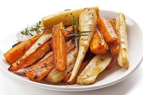 roasted carrots and squash on a white dish