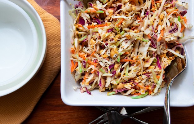 tr-colored coleslaw in a white bowl