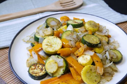 simple veggie stir fry with yellow squash, zucchini, orange bell pepper, and onion