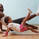 Father and daughter exercising