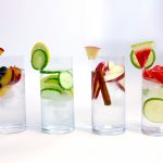 glasses or water flavored with fruits and vegetables