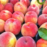 flat of ripe peaches