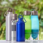 blue sports water bottles on table outside