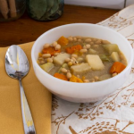 bowl of soup with spoon on napkin