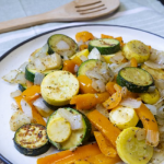 vegetables on plate with wooden spoon