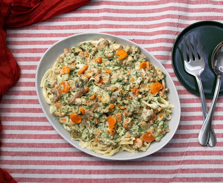 bowl of pasta next to utensils