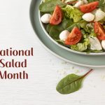 National Salad Month. Diet and healthy salad with lettuce, spinach, arugula, mozzarella and cherry tomato.